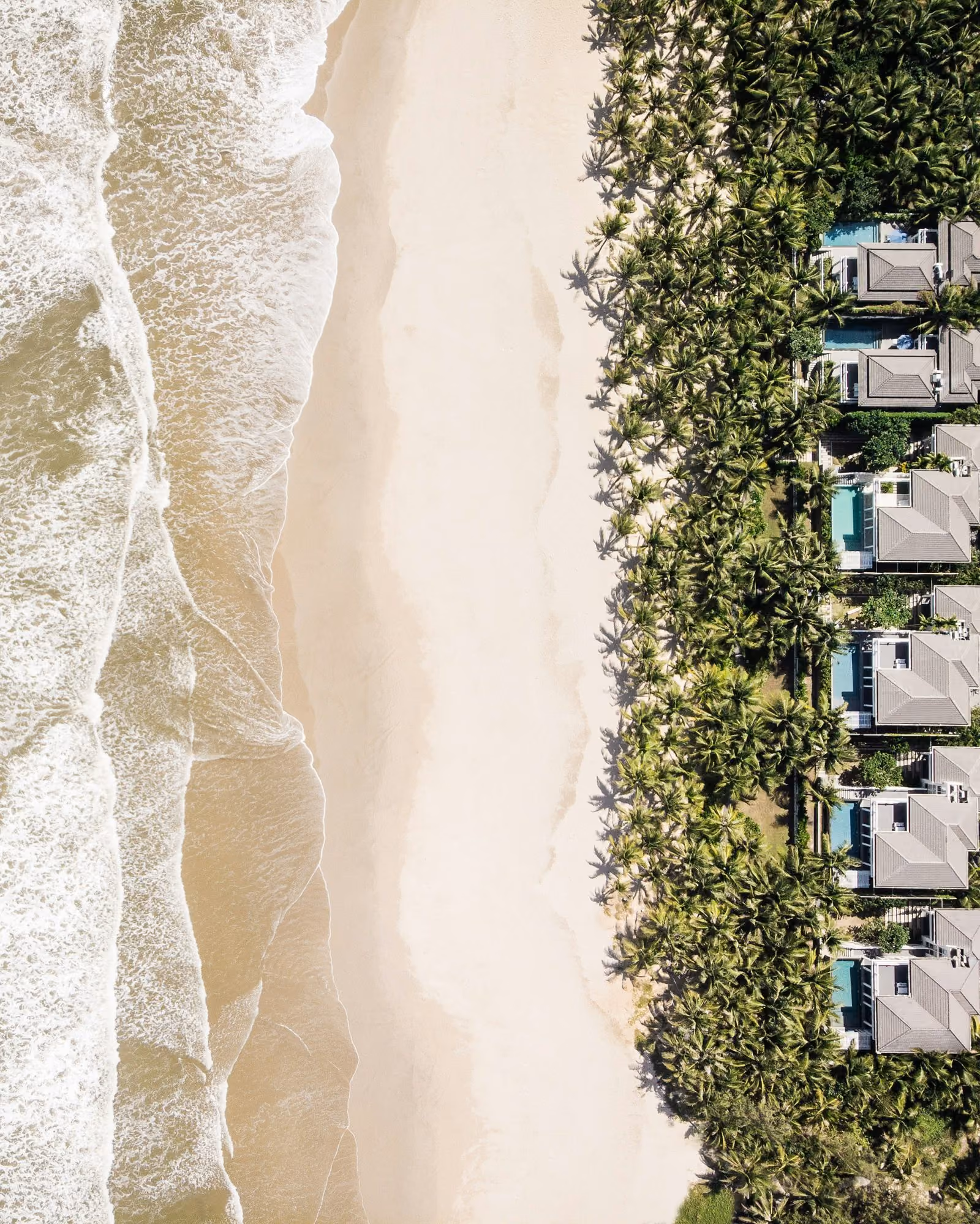 Aerial view of beachfront villas along a Florida shoreline