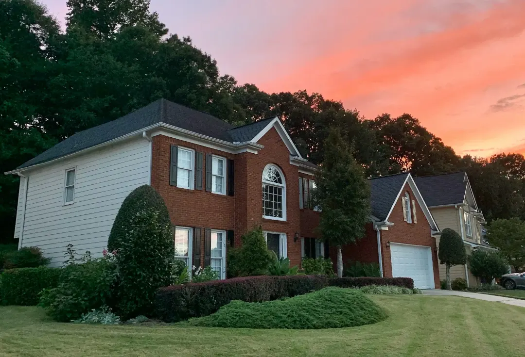 brick front house with front yard landscaping