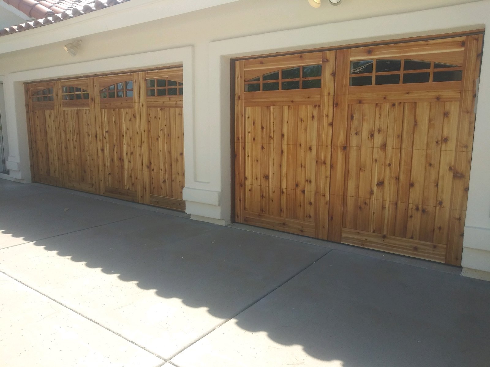A pair of light oak carriage style garage doors