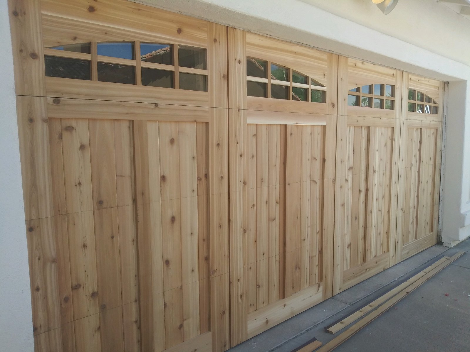 Cedar garage door with a glazed top section
