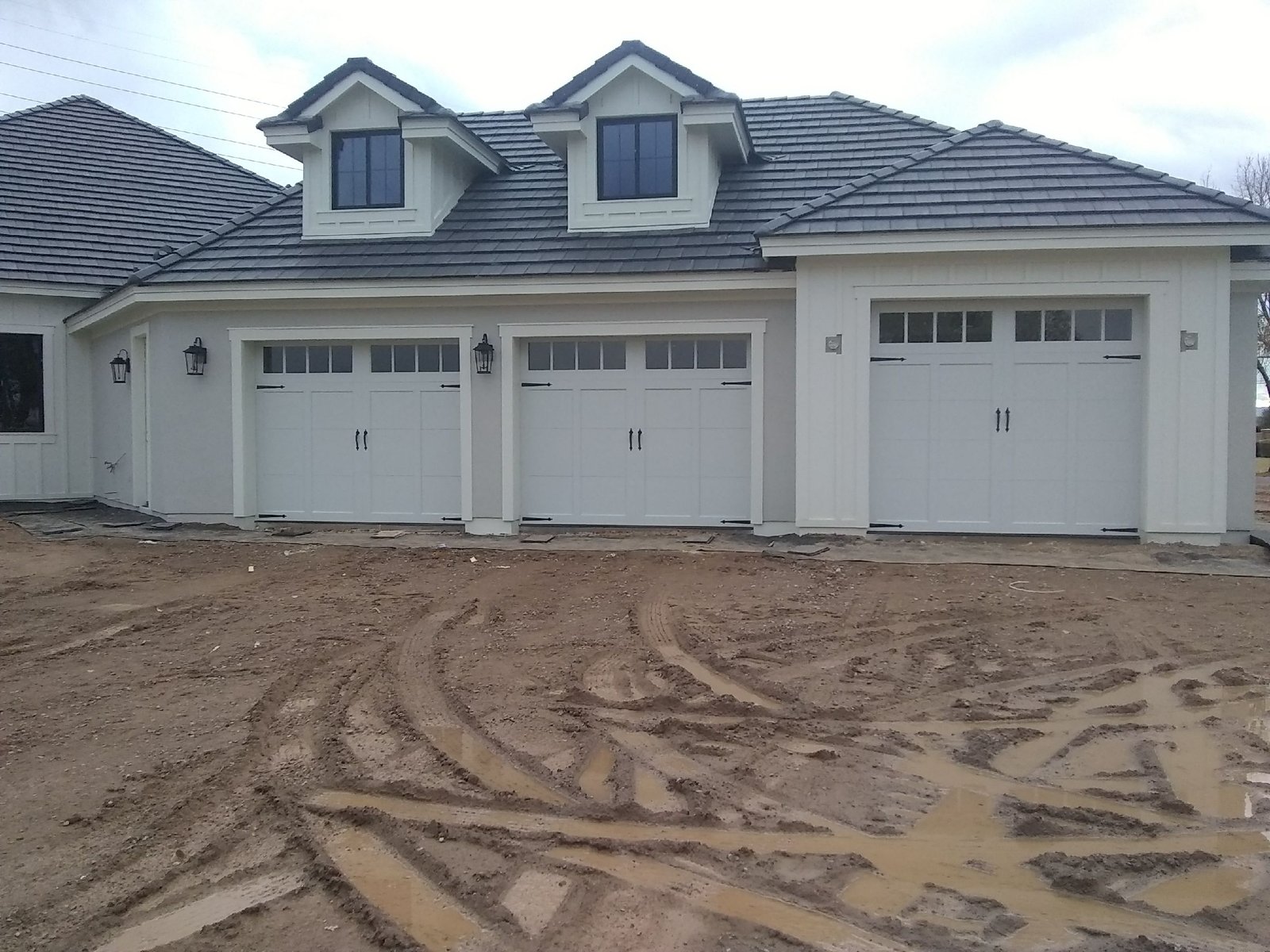 White three car garage doors on a new build home
