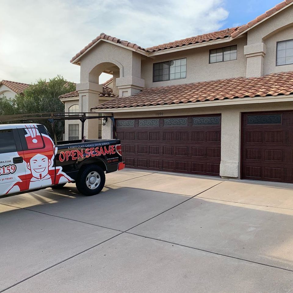 Open Sesame service truck outside a two storey Arizona home