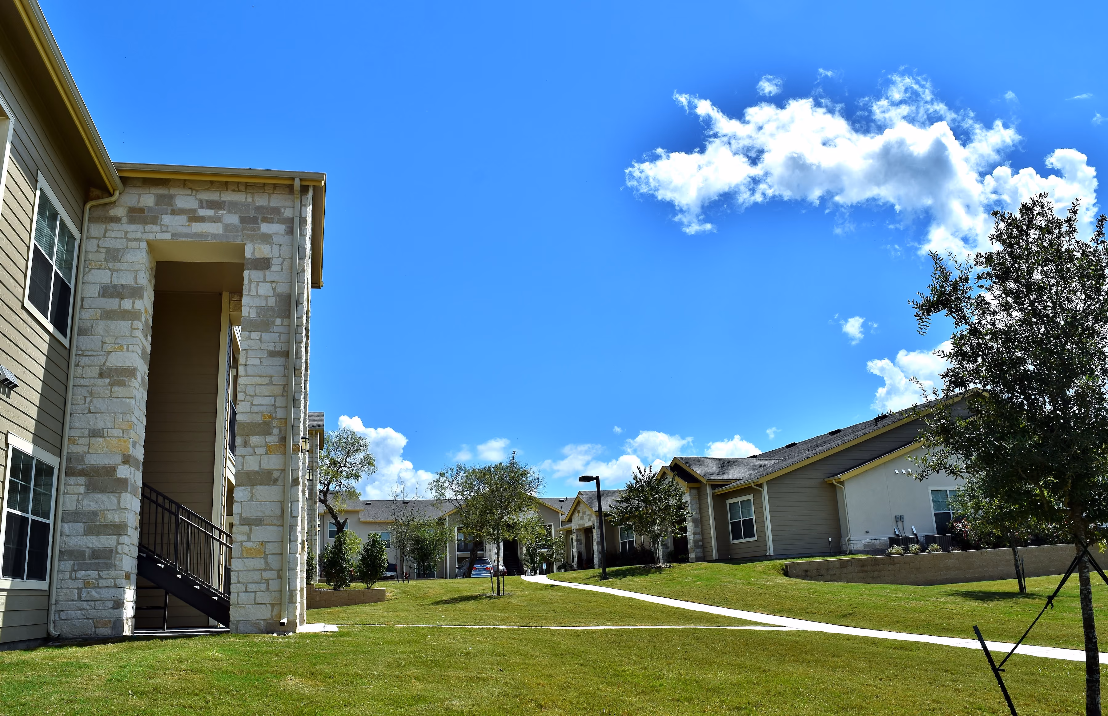 Exterior building and grass area and sidewalk