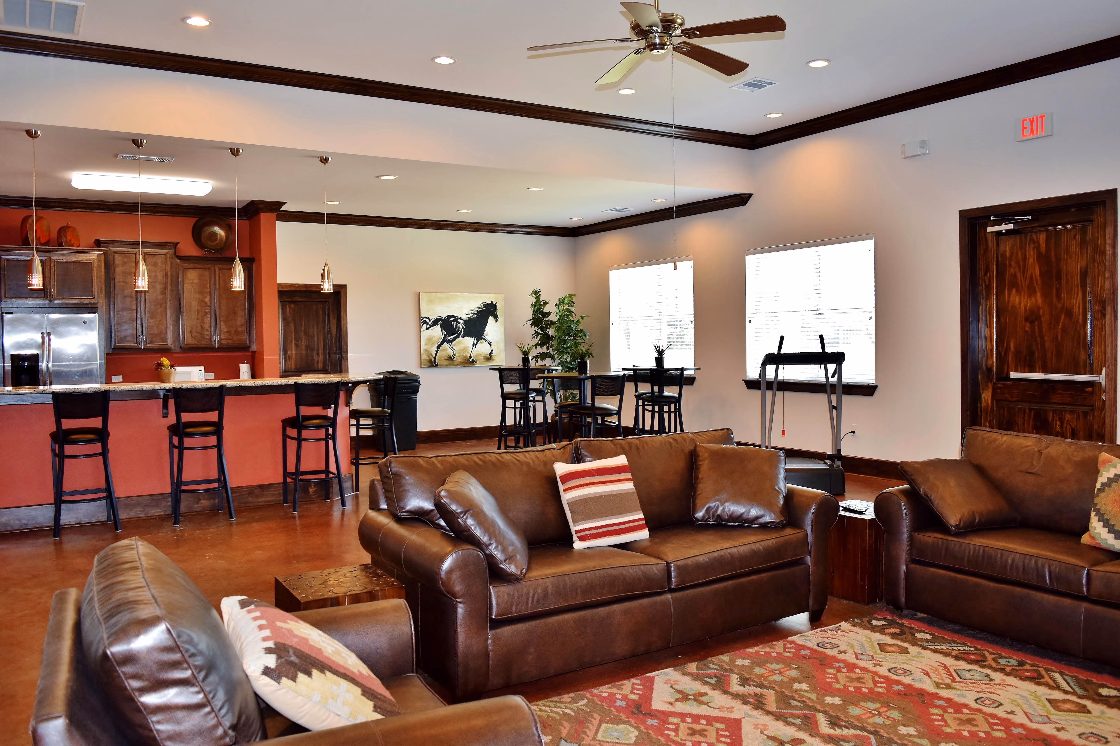 Recreation Room with couches, high top seating and kitchen