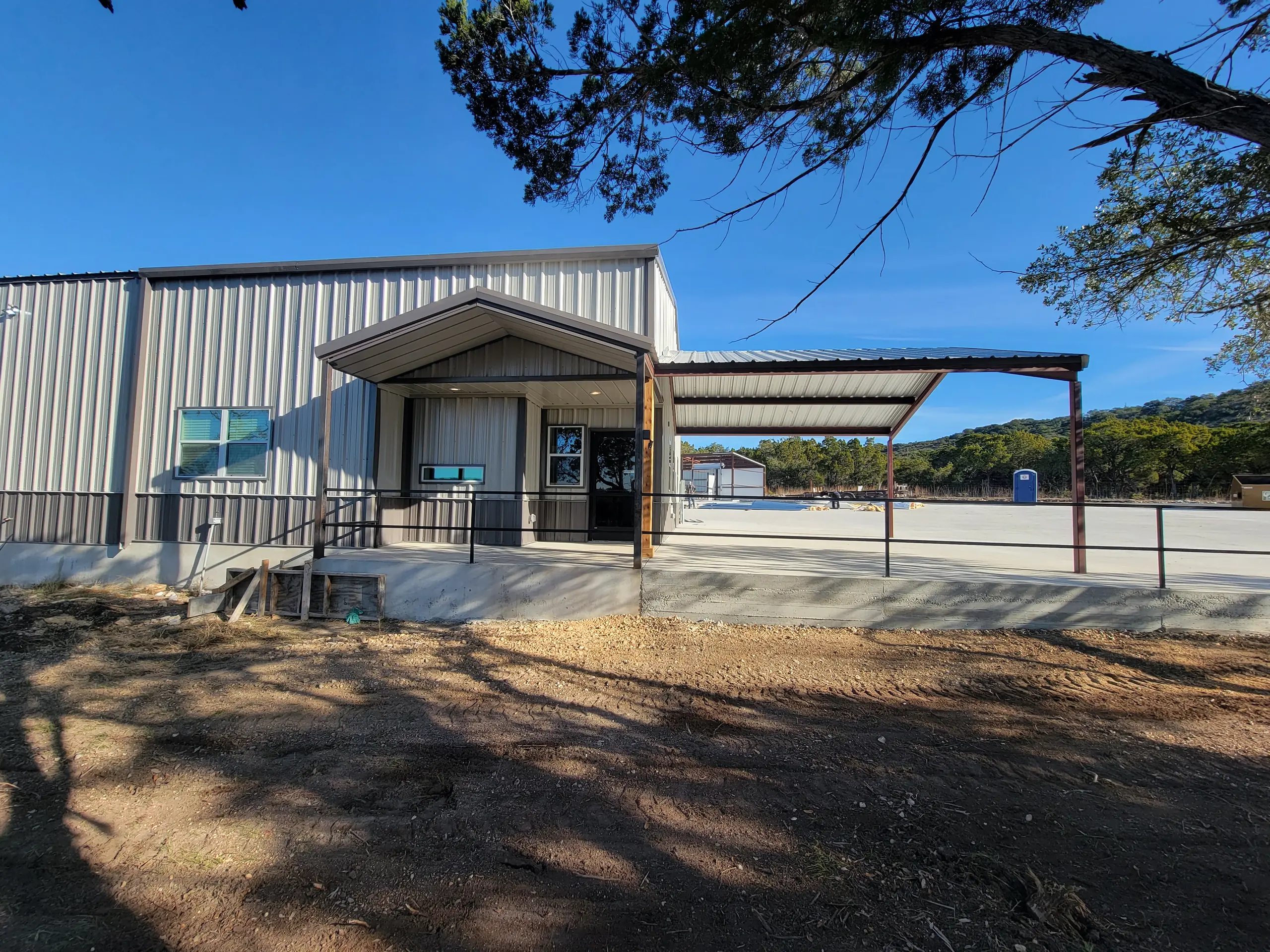 Gabled entry porch and covered walkway at the office end of the complex