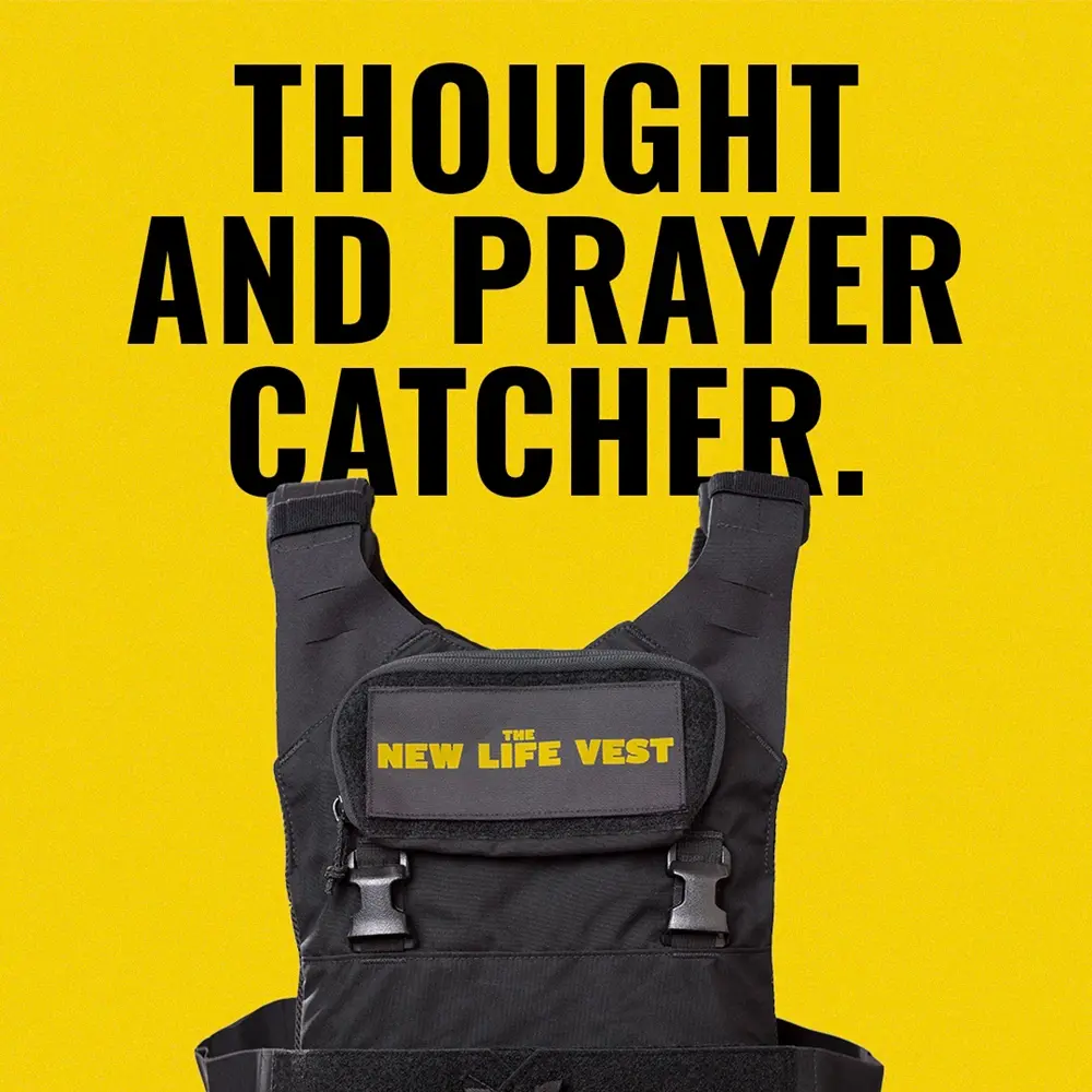 Black bulletproof vest labeled The New Life Vest against a yellow background with text Thought and Prayer Catcher.