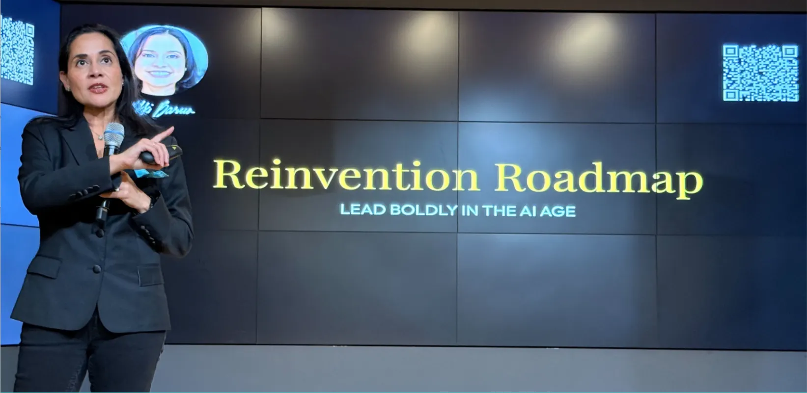 Nikki Barua speaking on stage, Reinvention Roadmap keynote
