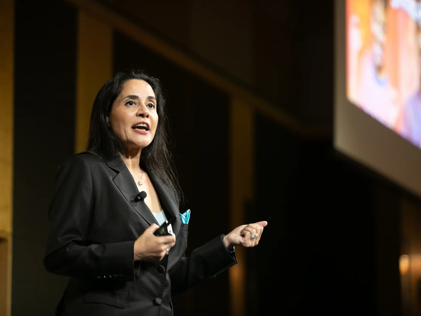 Nikki Barua speaking on stage