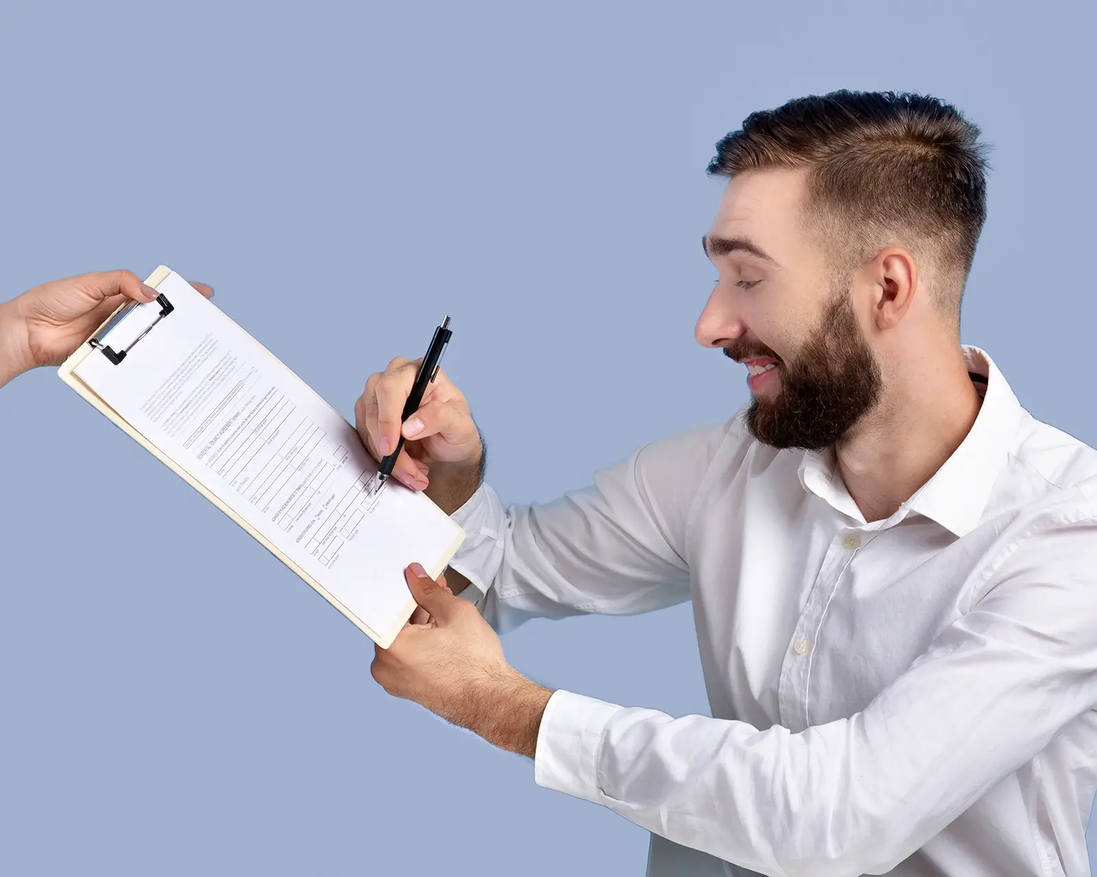 Businessman signing a commercial loan contract on a clipboard with a financial adviser