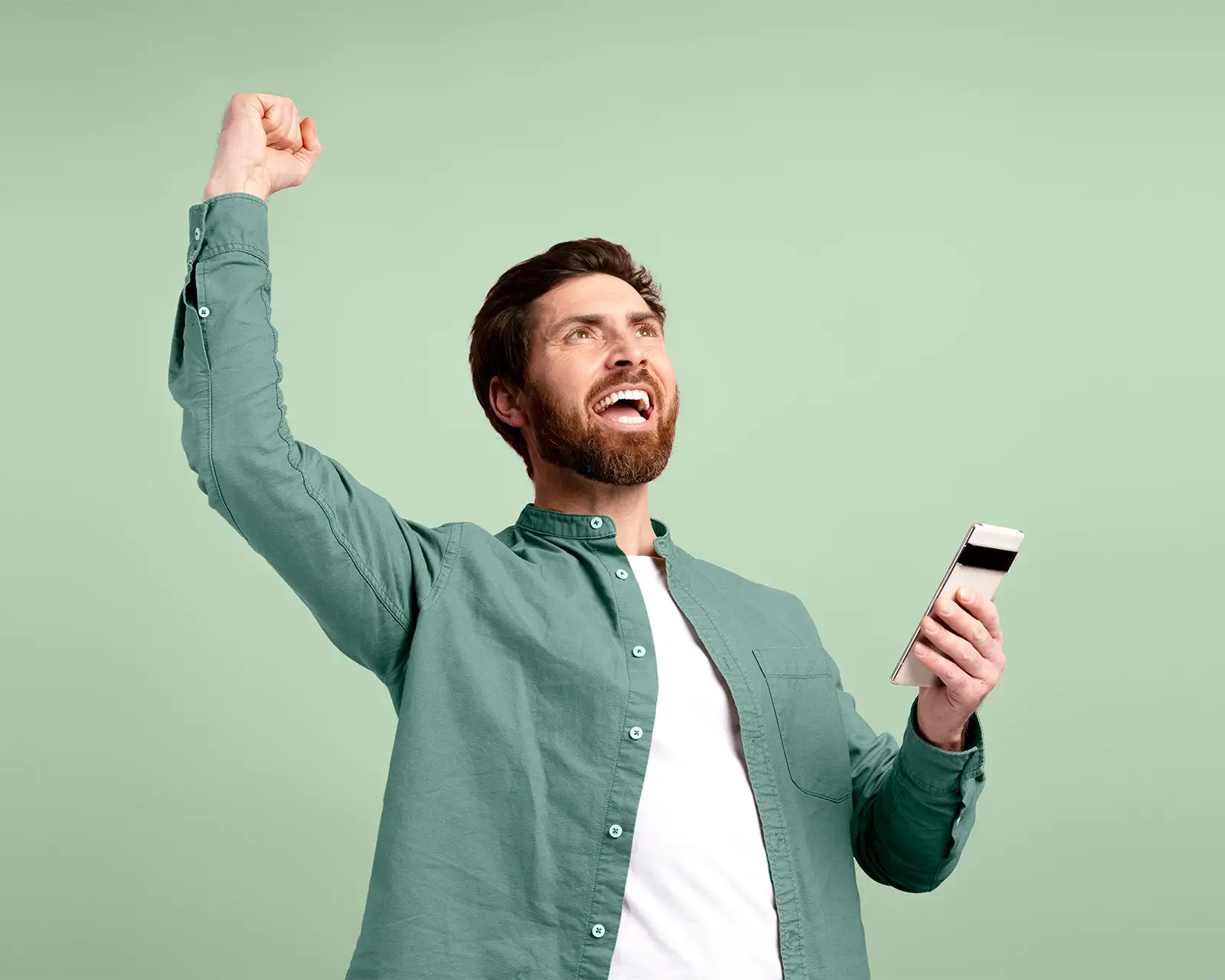 Excited man celebrating fast loan approval on his smartphone with a financial adviser