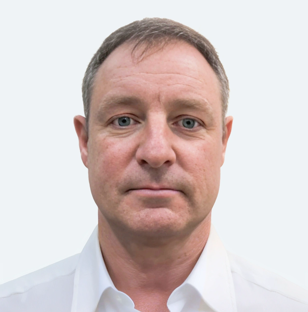 The Loan Supply Co team member headshot of Vaughan Beazer on a white background with a white collared shirt