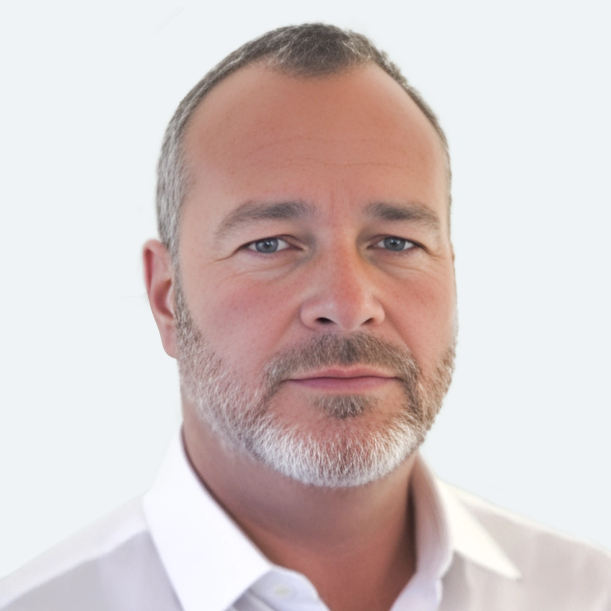 The Loan Supply Co founder and team member headshot of Chris Southworth on a white background with a white collared shirt