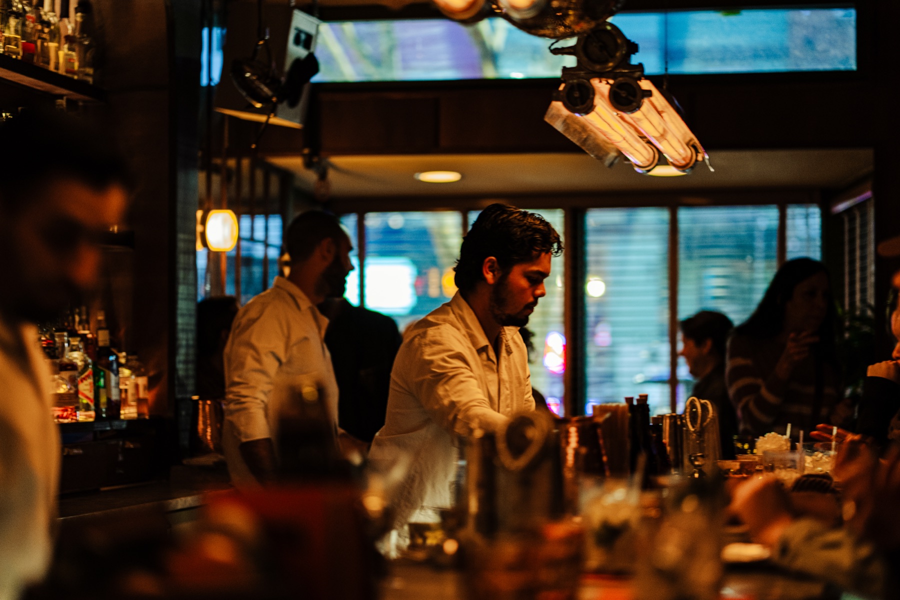 CANA bartenders working during evening service