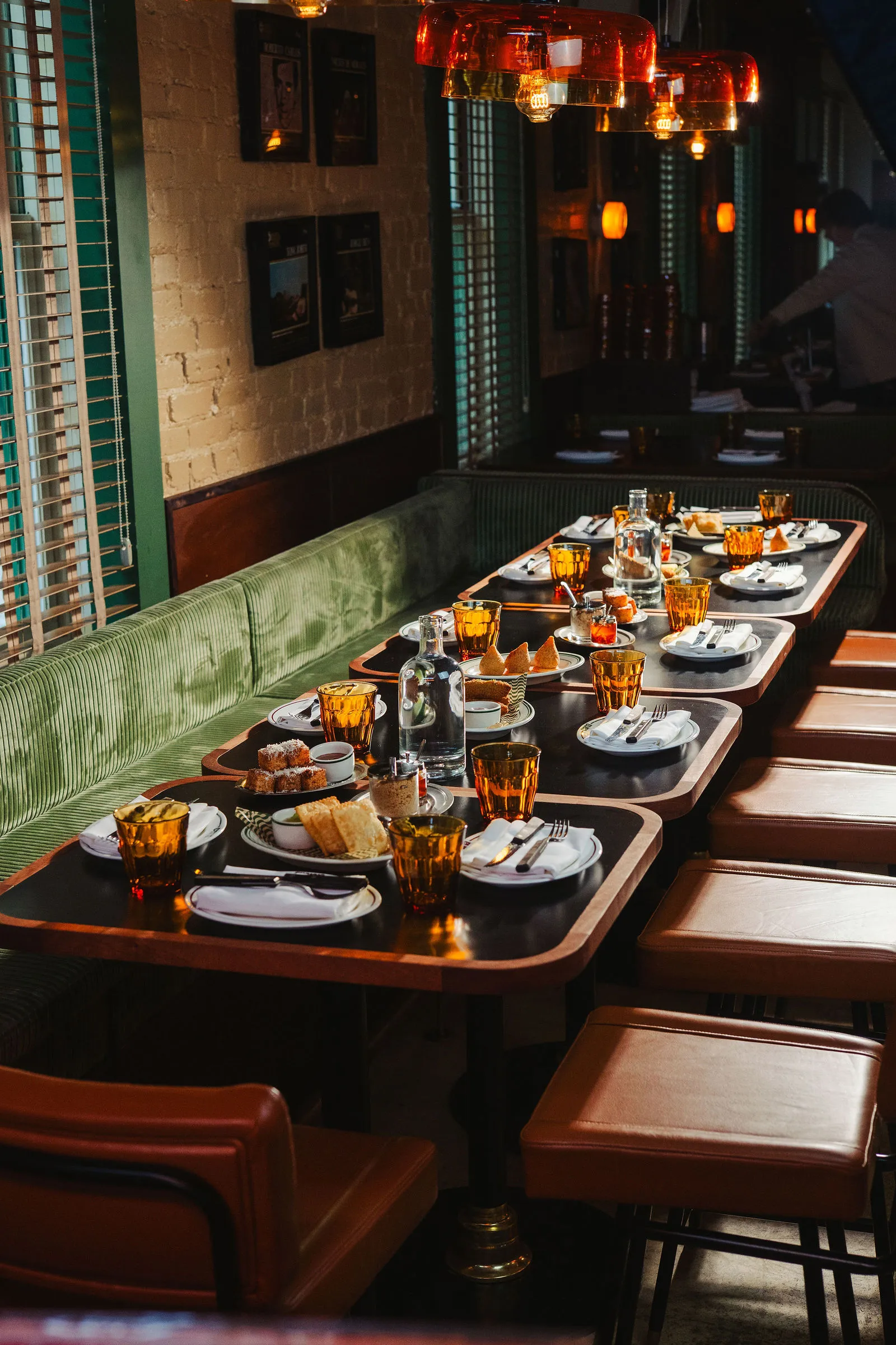 A long table set for a group dinner at CANA