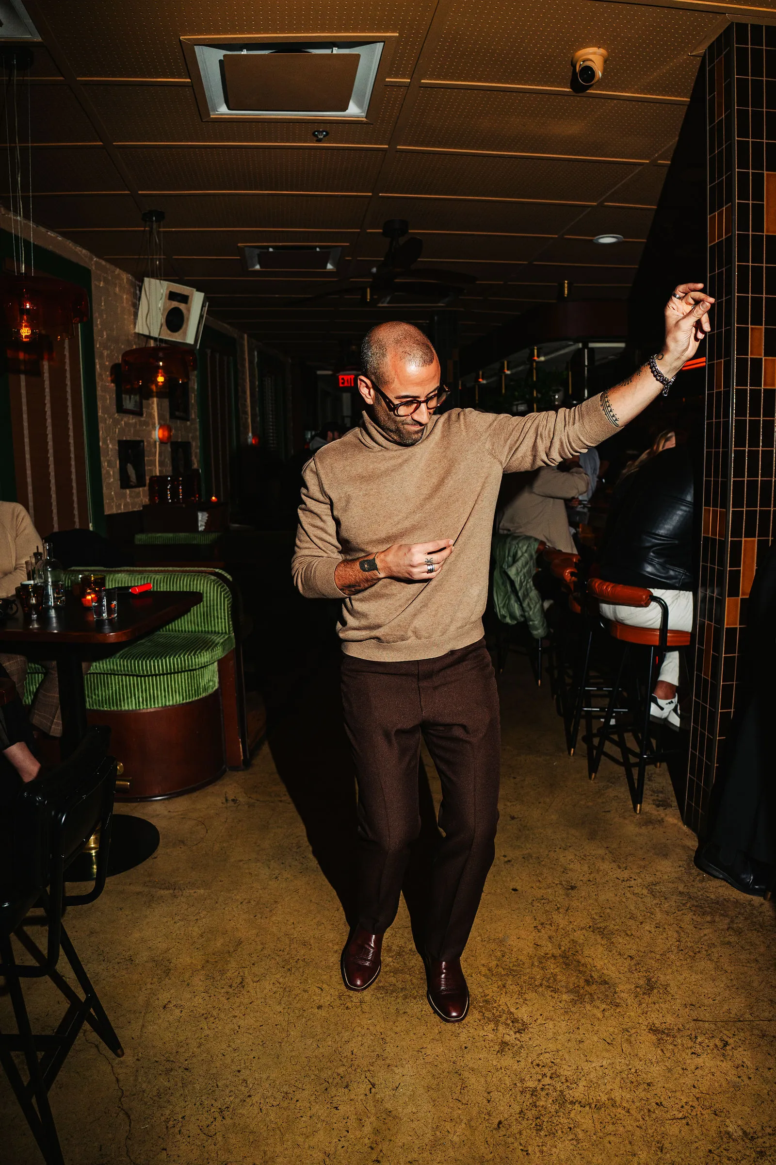 A guest dancing through CANA's dining room