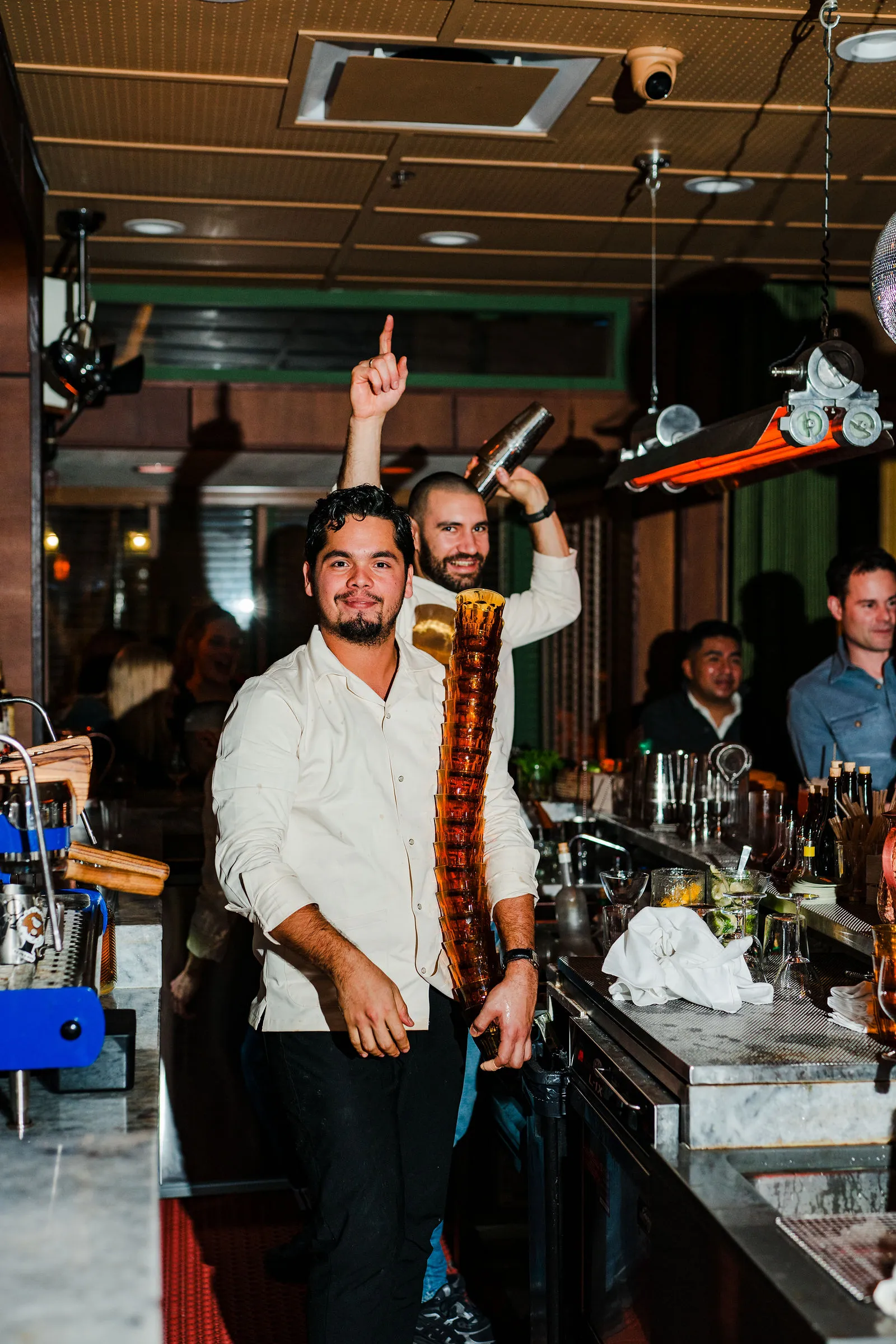 CANA bartenders working the bar during evening service