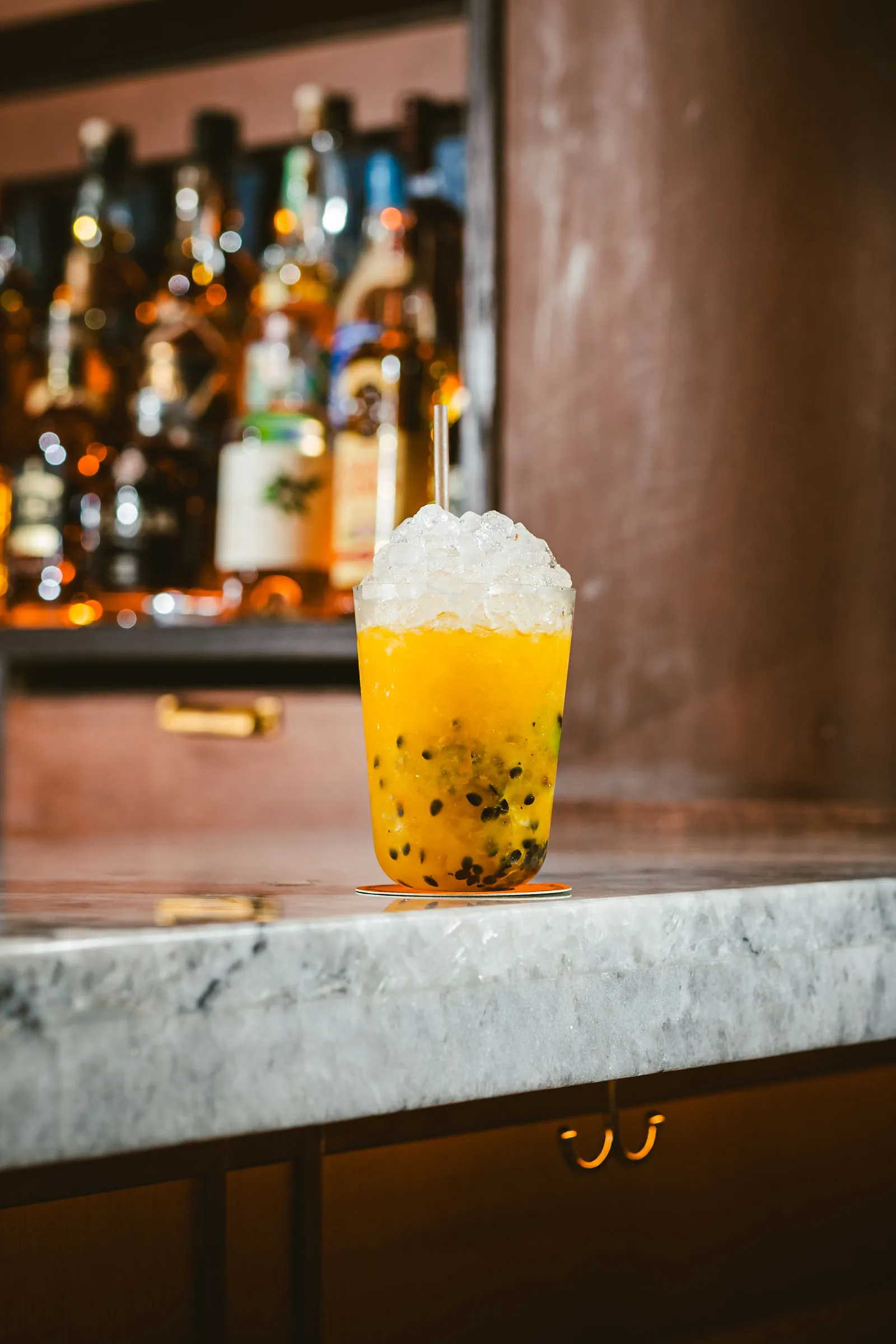 Two cocktails at CANA in front of the record collection