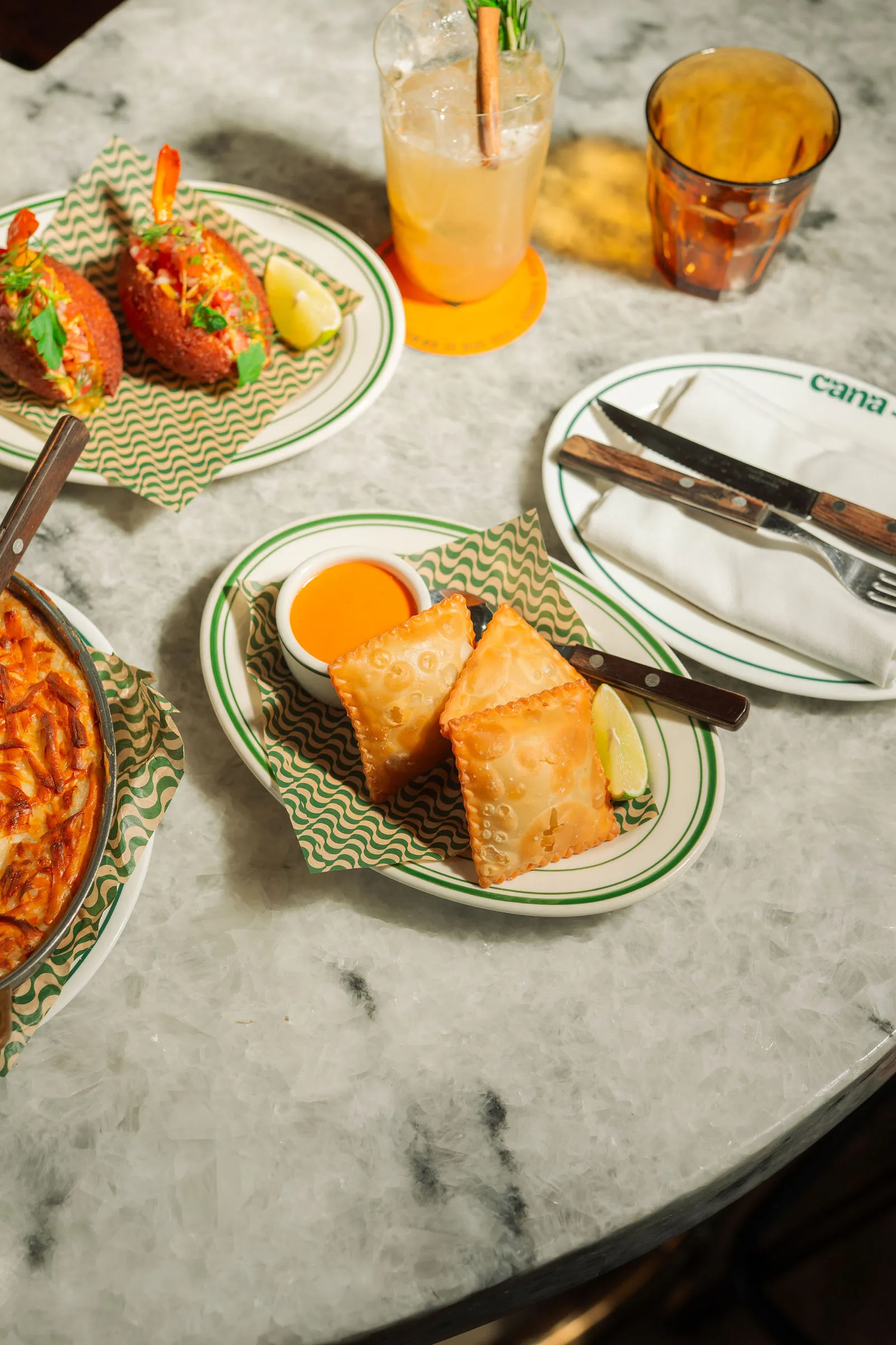 Pastéis being placed on the table at CANA