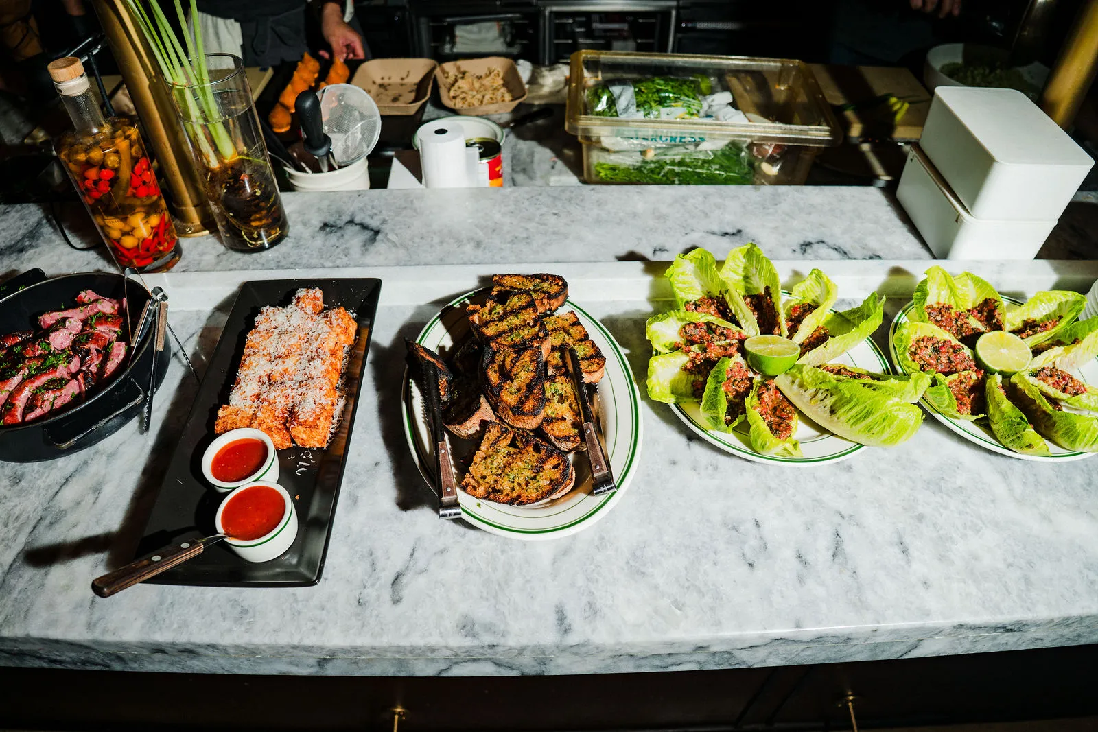 Food and cocktails shared at CANA's bar