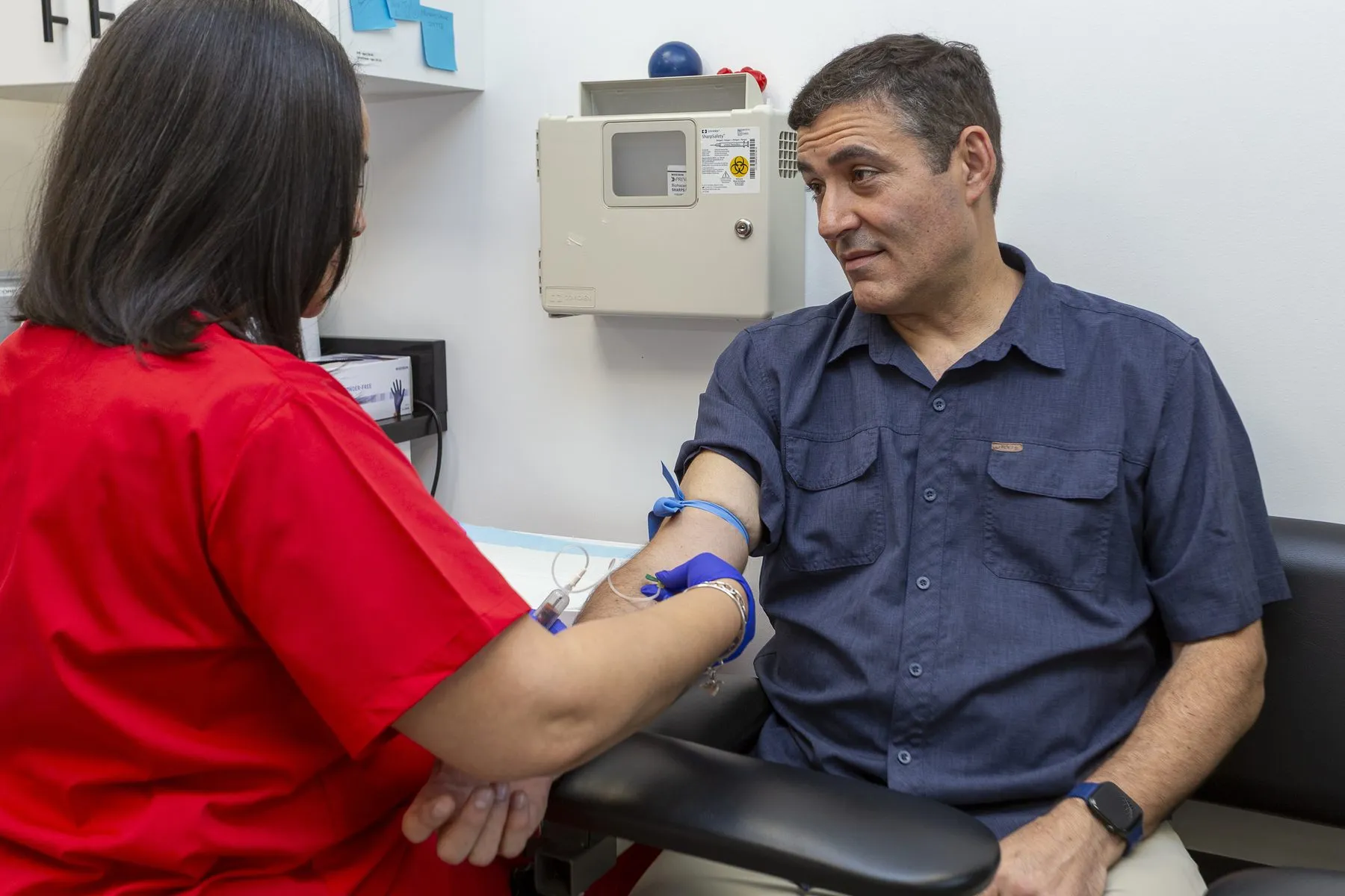 Clinician checking a patient's blood pressure at OHS Total Care