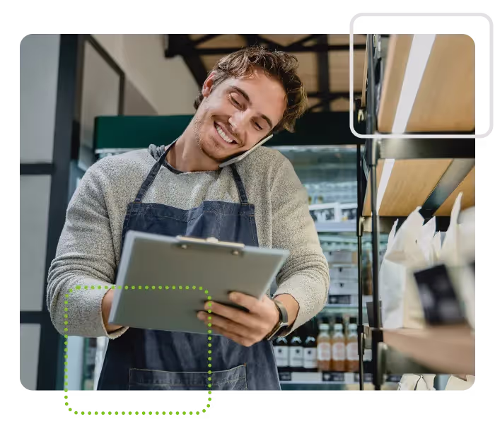 Auditor or verifier using note pad in kitchen
