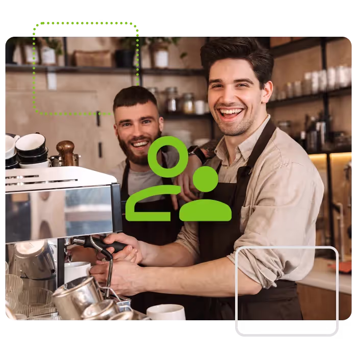 Two baristas making coffee