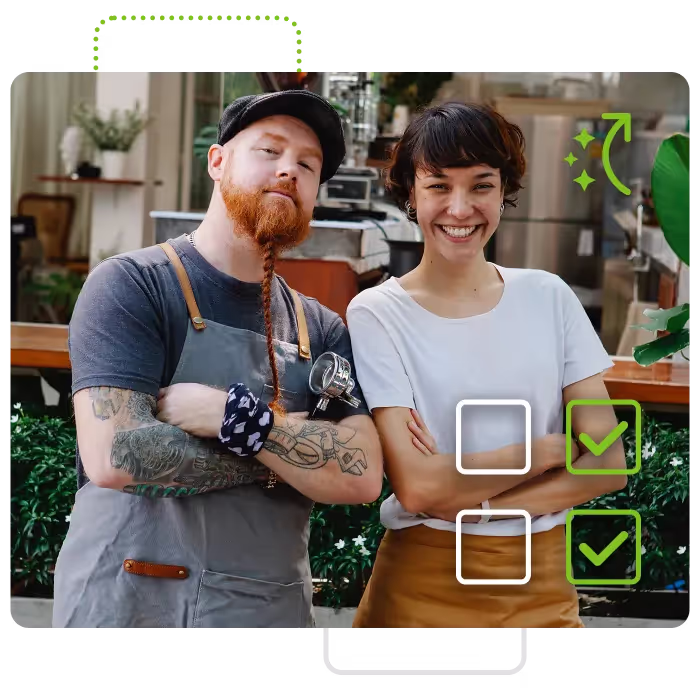 Two hospitality workers smiling
