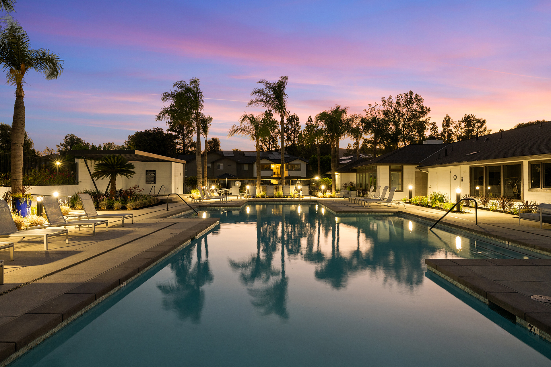 Evening Pool with lounge chairs