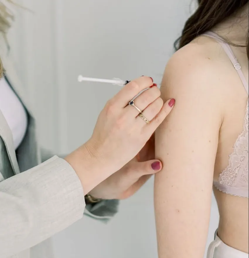 Naturopath administering hormone injections