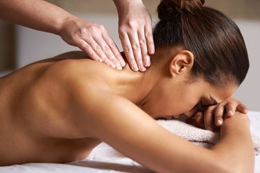 Woman releasing stress with a neck massage