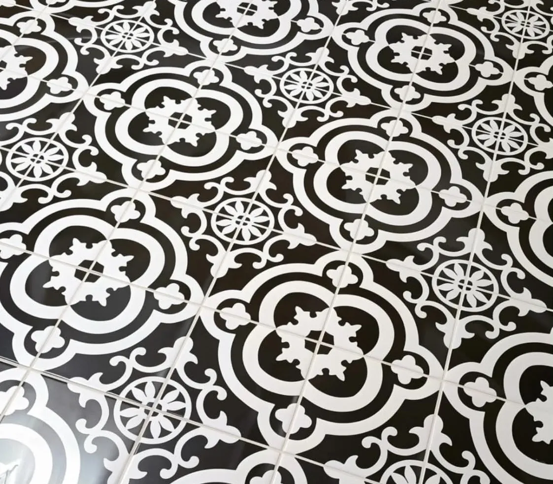 Patterned encaustic tile floor, with the pattern held true across the room, installed by Euphoric Tile & Design in coastal Maine