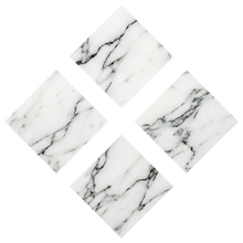 Reversed, for dark backgrounds. The monogram tiles carry a marble texture in this version.