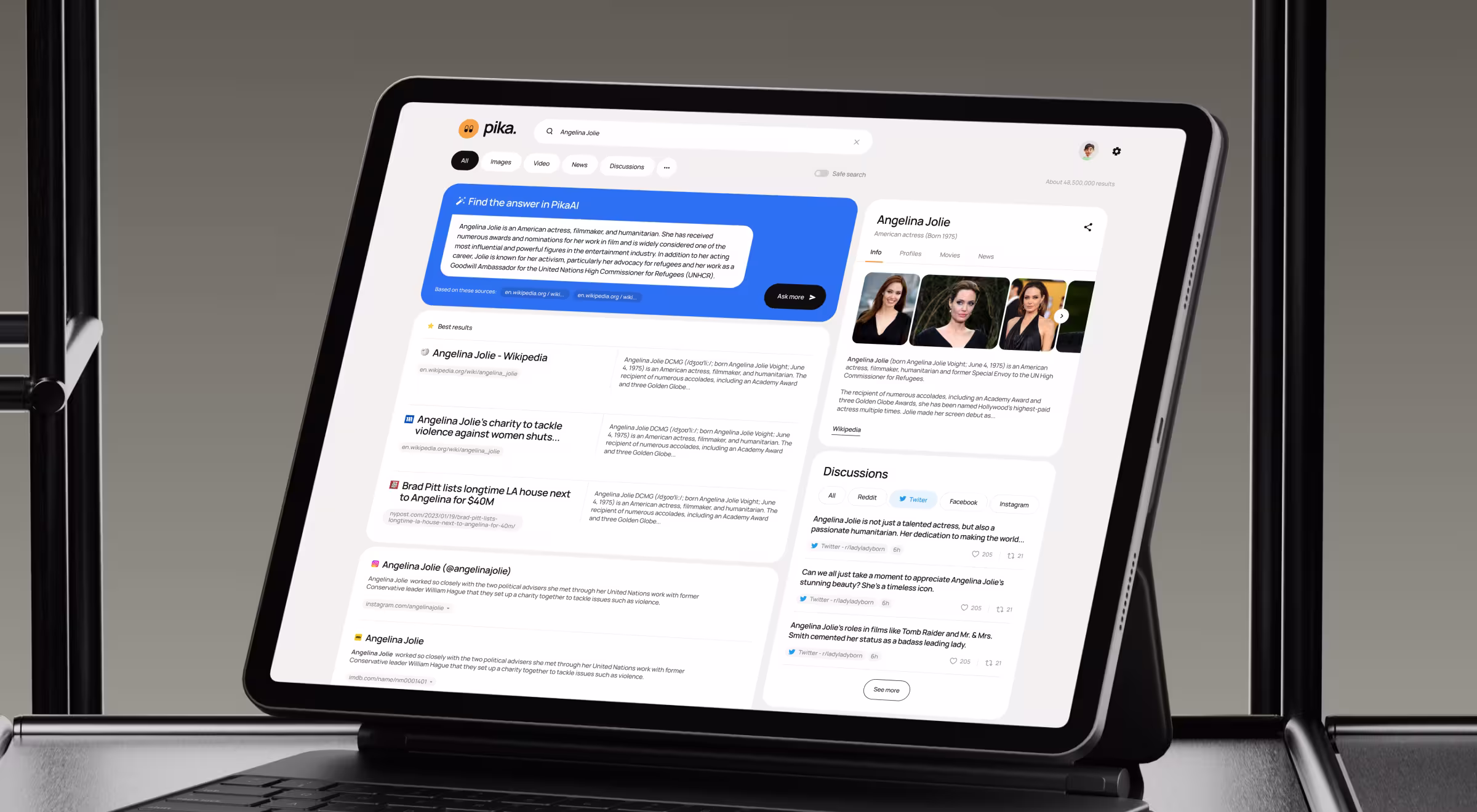 Tablet displaying Pika search interface with a query for ‘Angelina Jolie,’ showing an AI-generated answer panel, search results, photos, and discussion posts. The screen includes tabs for images, video, news, and discussions within a clean white UI on a modern device stand