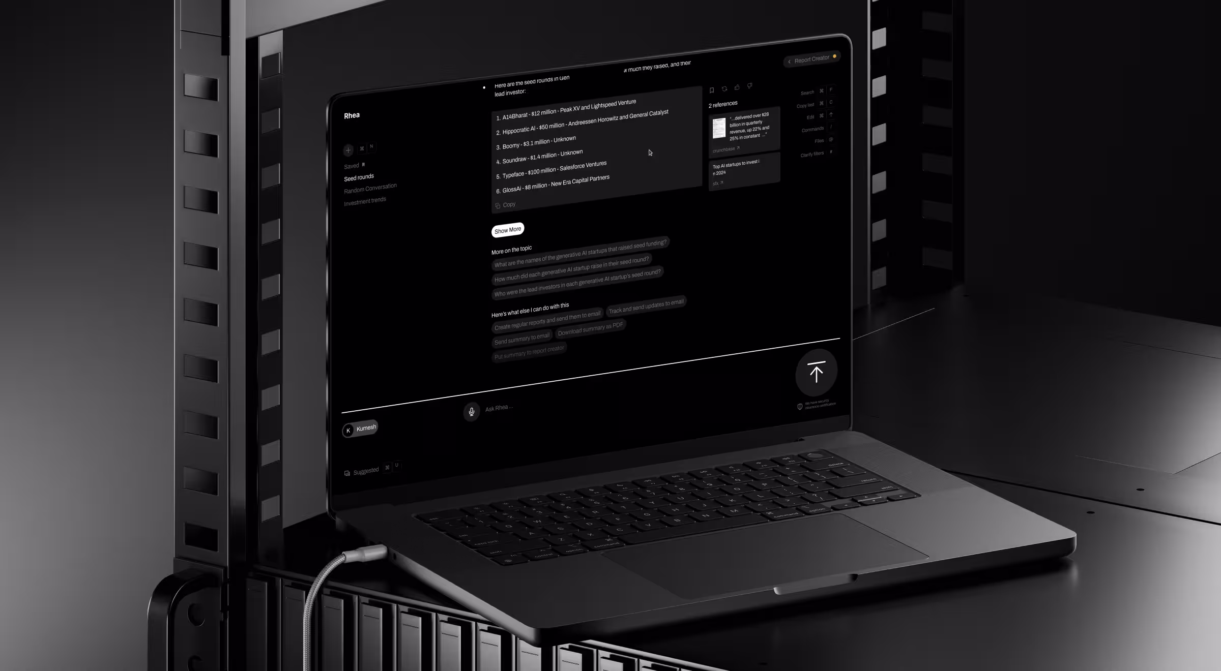 Laptop displaying an AI-powered research platform with conversational search, source references, and report generation tools in a dark enterprise interface.