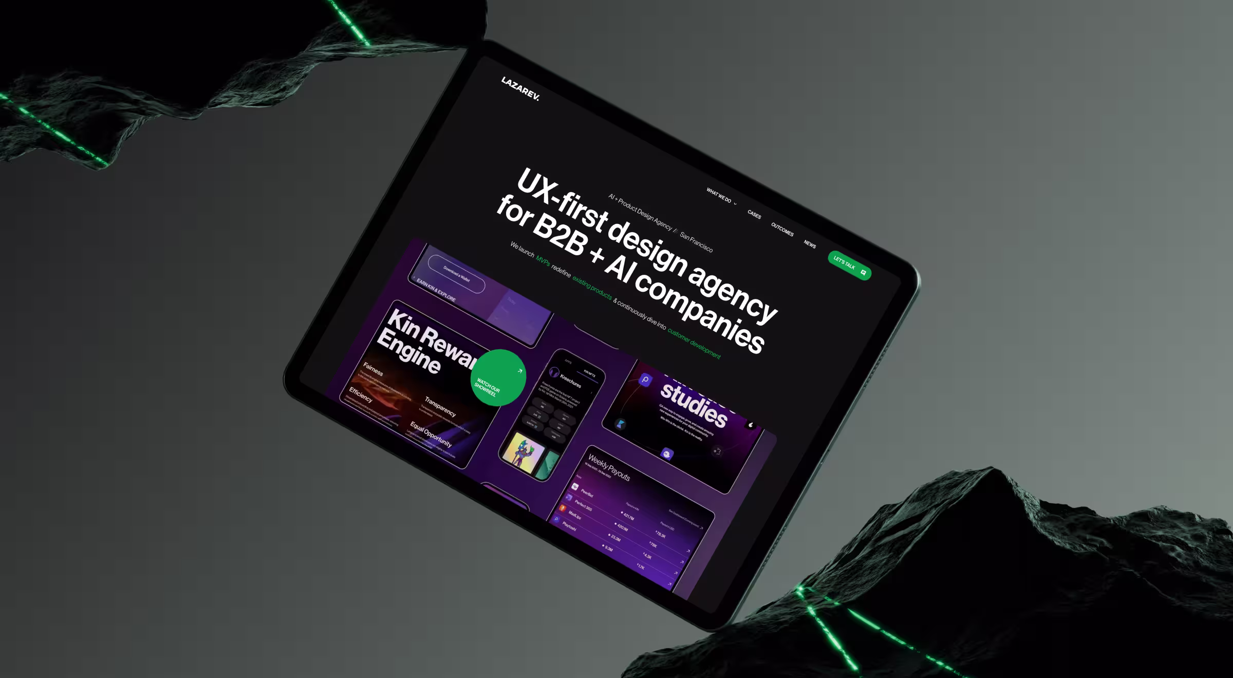 Tablet displaying Lazarev.agency homepage with headline “UX-first design agency for B2B + AI companies,” surrounded by dark rocks with glowing green accents