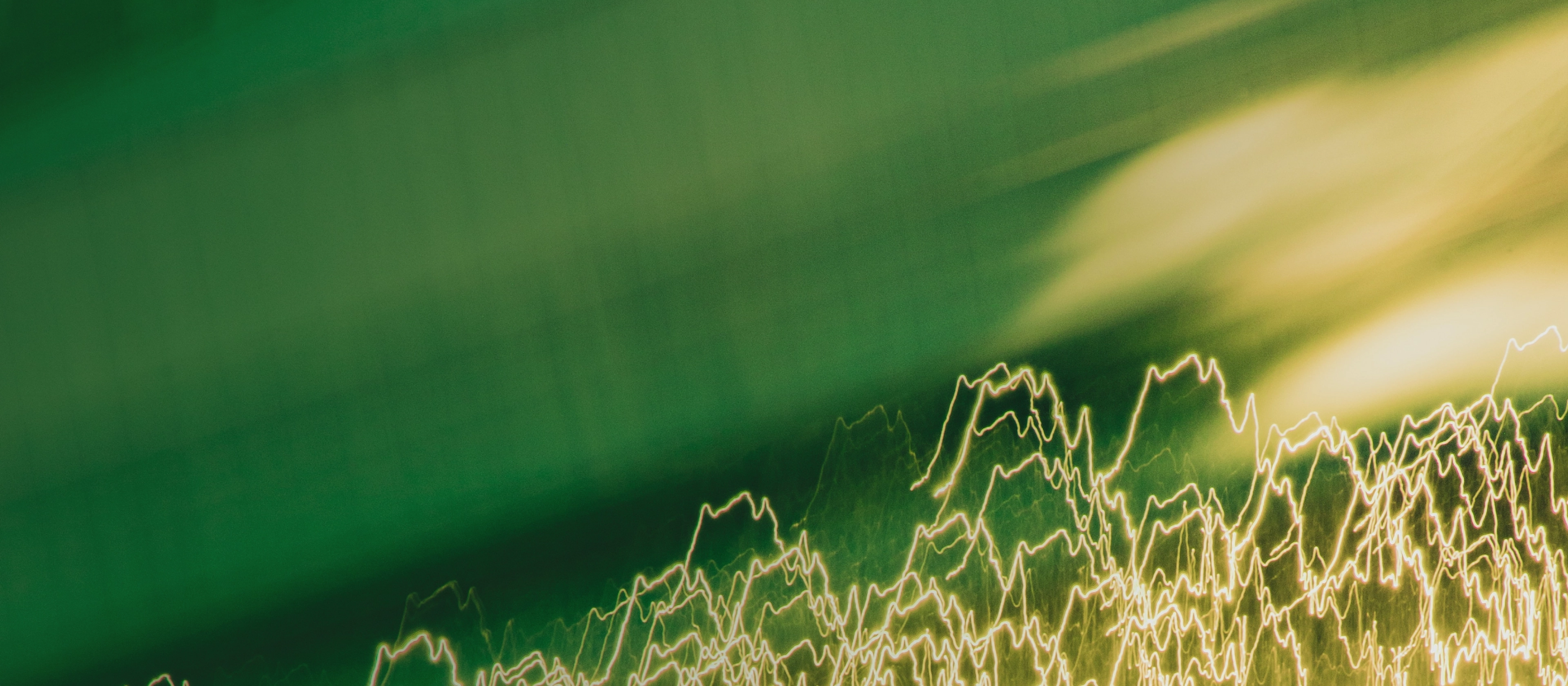 A green-colored picture with abstract figures on it.