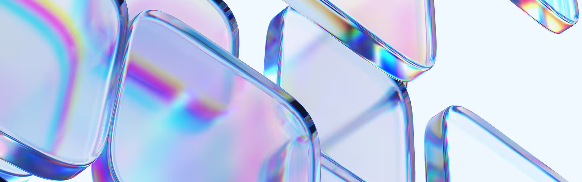 Abstract composition of translucent glass-like geometric panels with iridescent reflections in soft blue, pink, and violet hues.