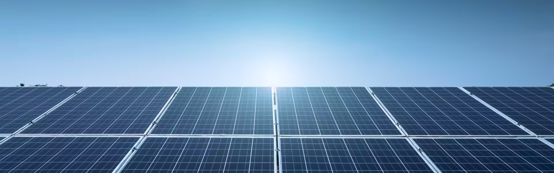 Solar panels under clear blue sky symbolizing clean energy innovation