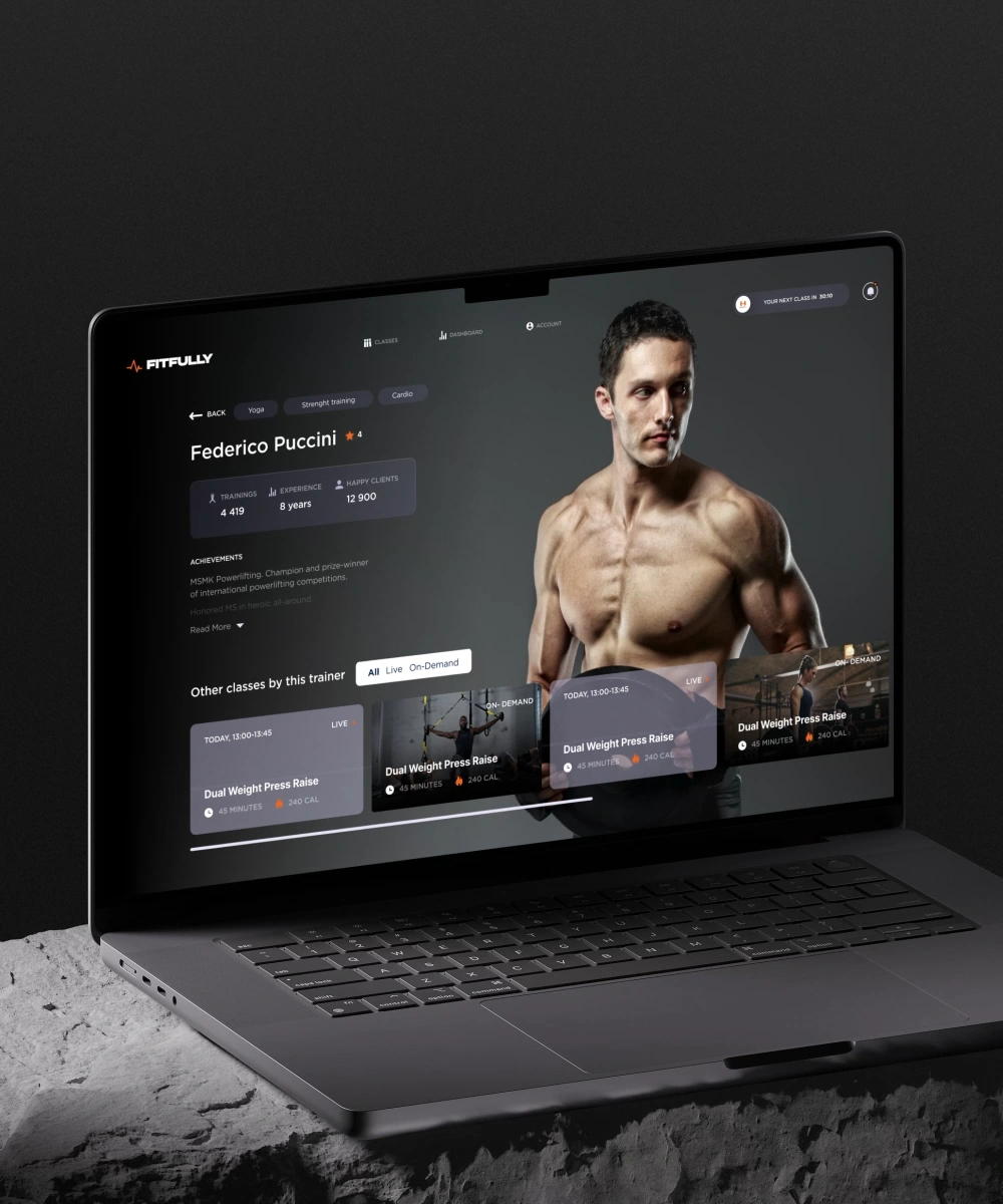 Laptop mockup showing the Fitfully fitness platform with a trainer profile, class filters, and workout cards on a dark interface.