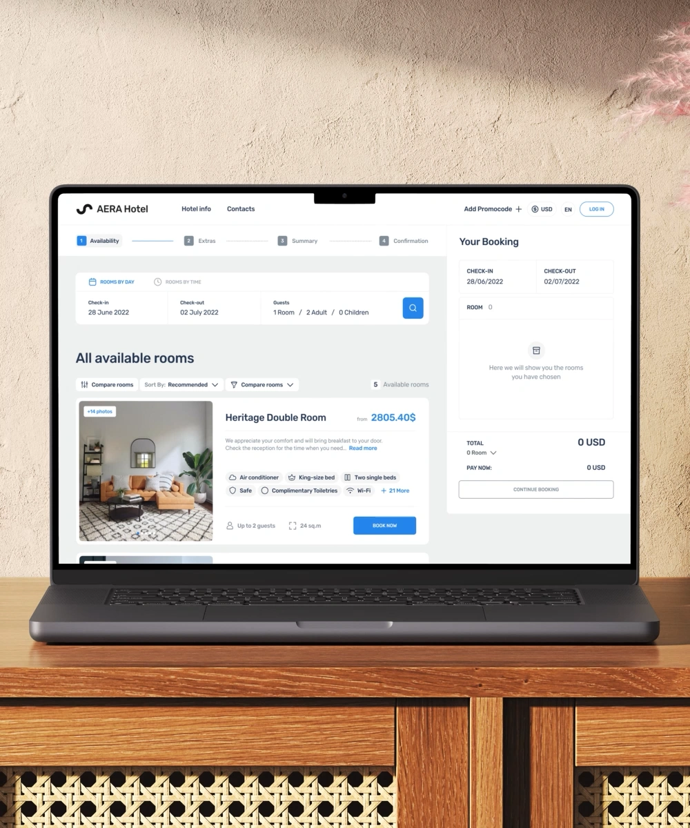 Dirs21 booking app on a laptop showing the availability step with room results and a live booking summary.