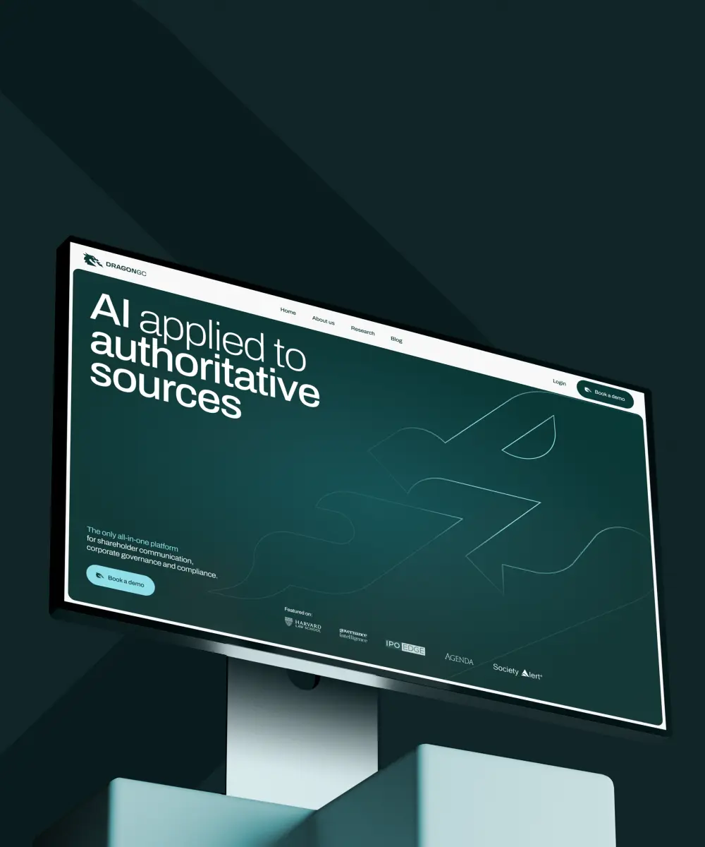 DragonGC: Monitor mockup on a dark teal background showing a website homepage headlined "AI applied to authoritative sources."