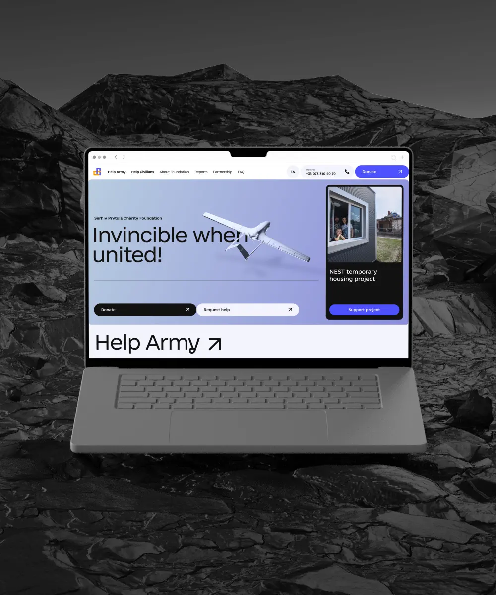 A laptop showing the first screen of the website of the Prytula Charity Foundation