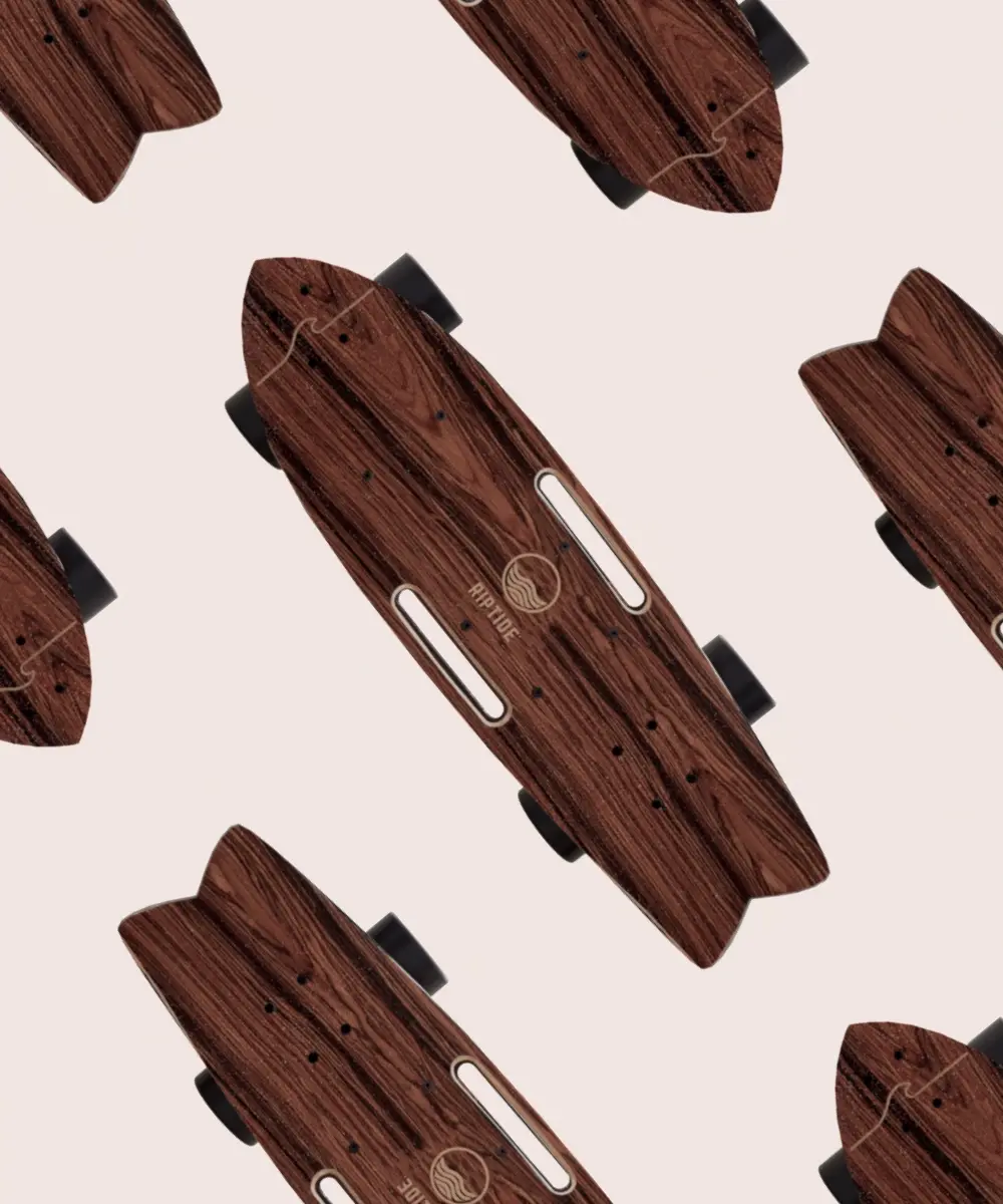 Pattern of Riptide electric skateboards with wood-finish decks arranged across a light background, emphasizing product design and branding.