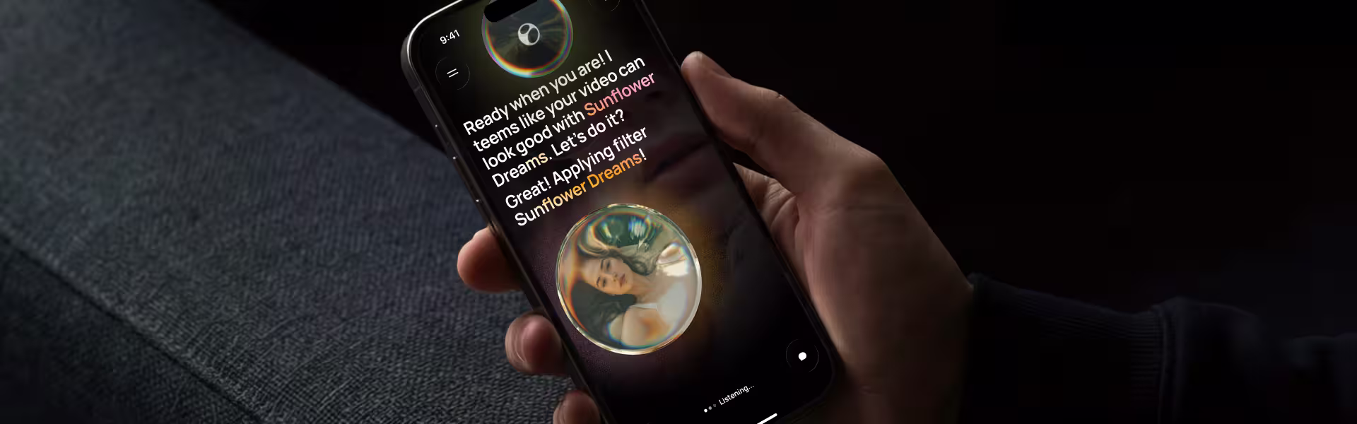 A hand holding a smartphone that displays a conversational voice interface responding "Great! Applying filter Sunflower Dreams!" with a live "Listening" indicator, illustrating an AI-native voice UI completing a task hands-free.