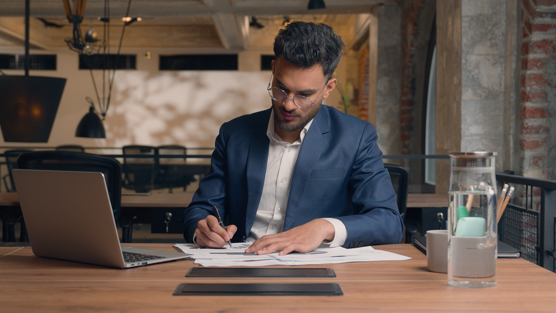 Professional reviewing reports to measure trade promotion effectiveness and KPIs.
