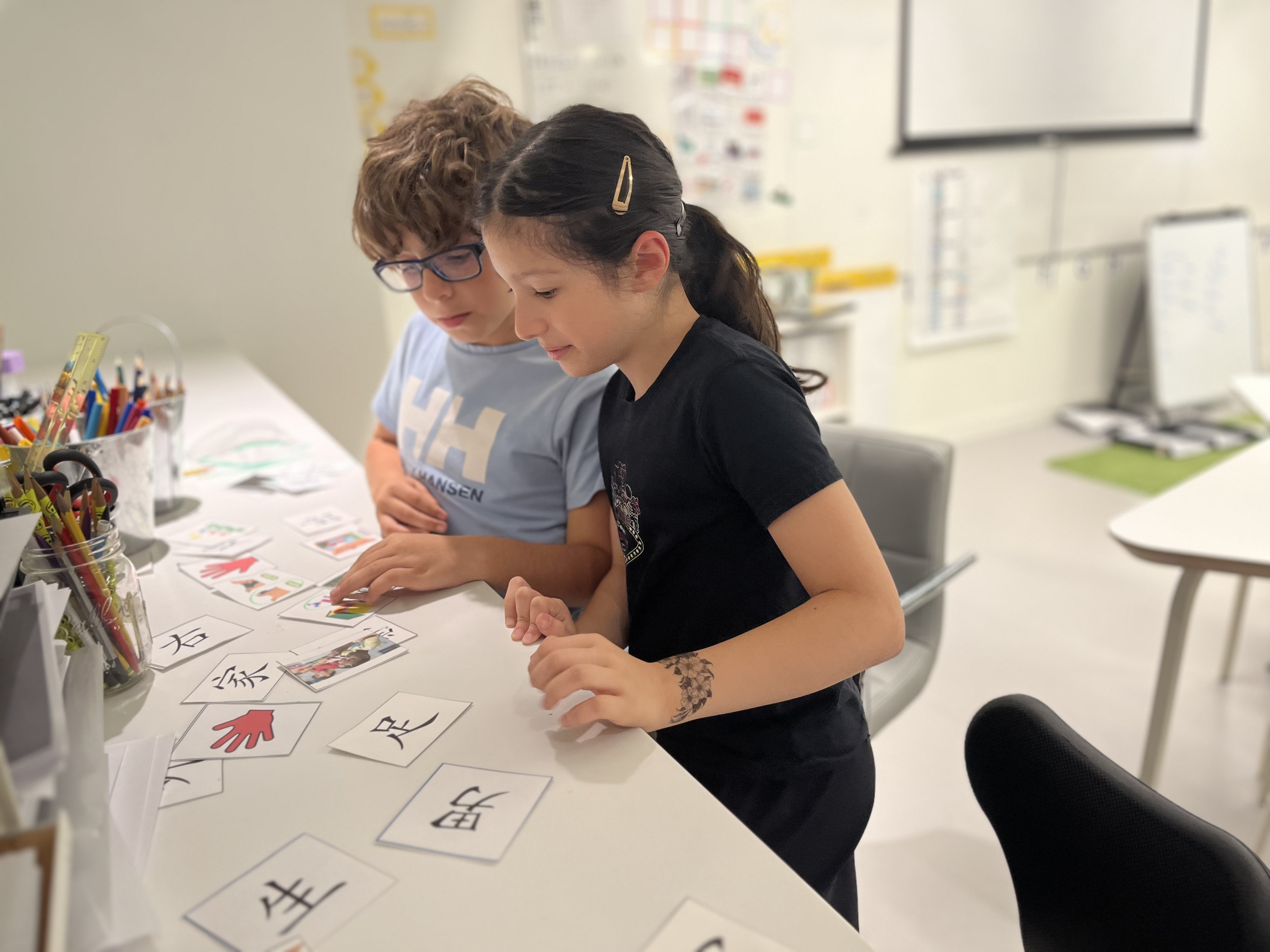 Two students working with Mandarin character cue cards at Pine Street School