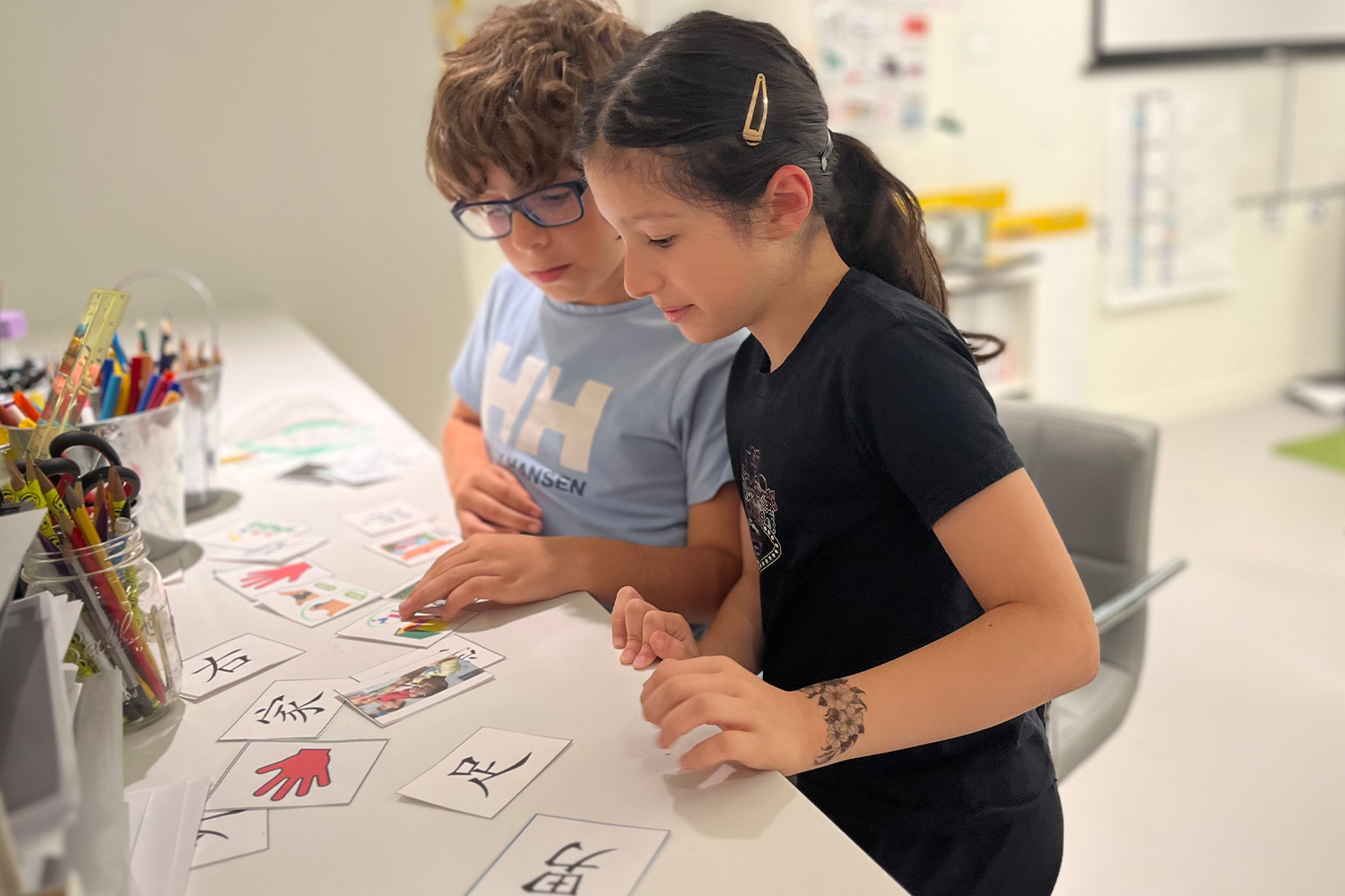 Two students working with Mandarin character cue cards at Pine Street School