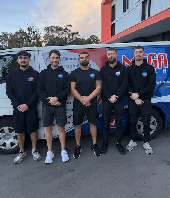Mega Clean senior cleaning technician in branded uniform with professional equipment