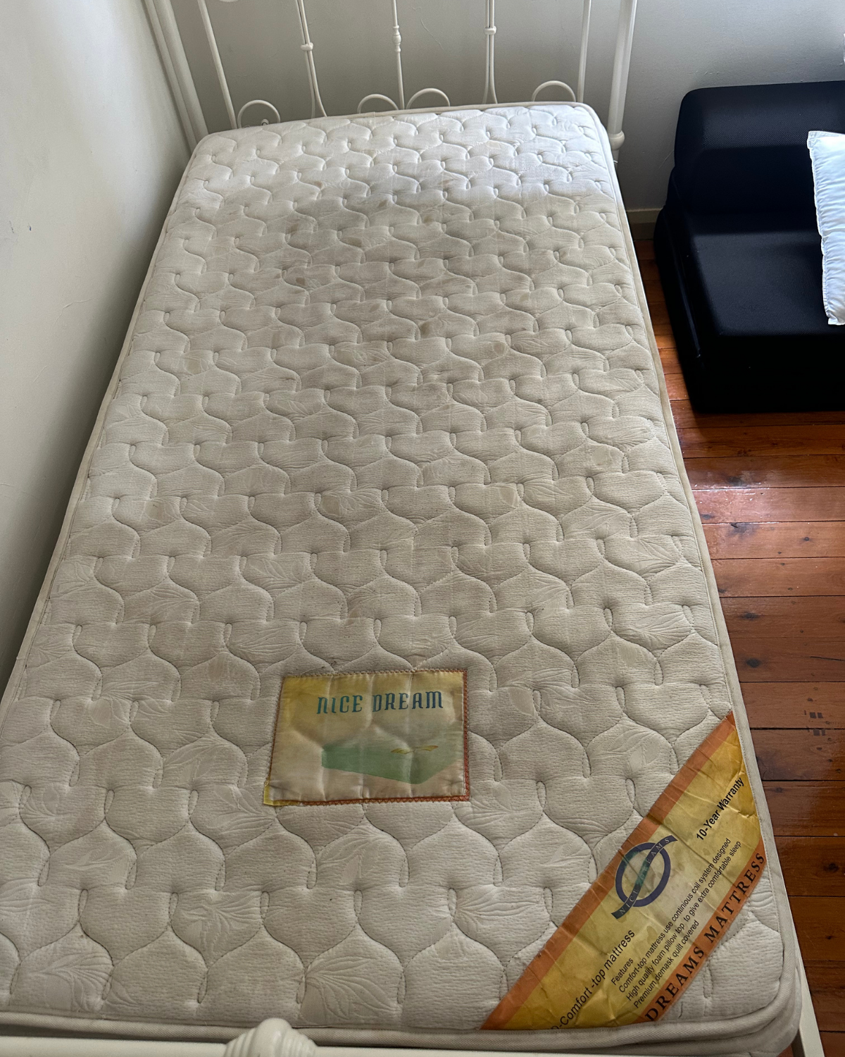 Mega Clean technician professionally deep cleaning a mattress
