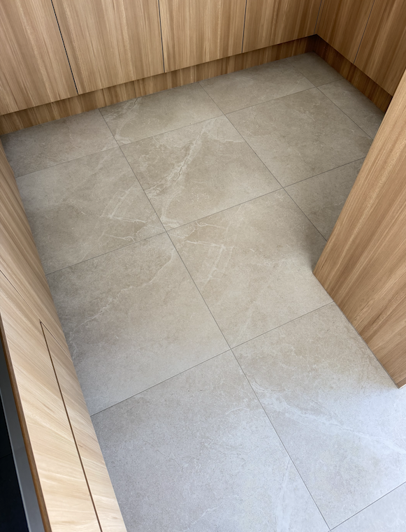 Before and after grout cleaning by Mega Clean